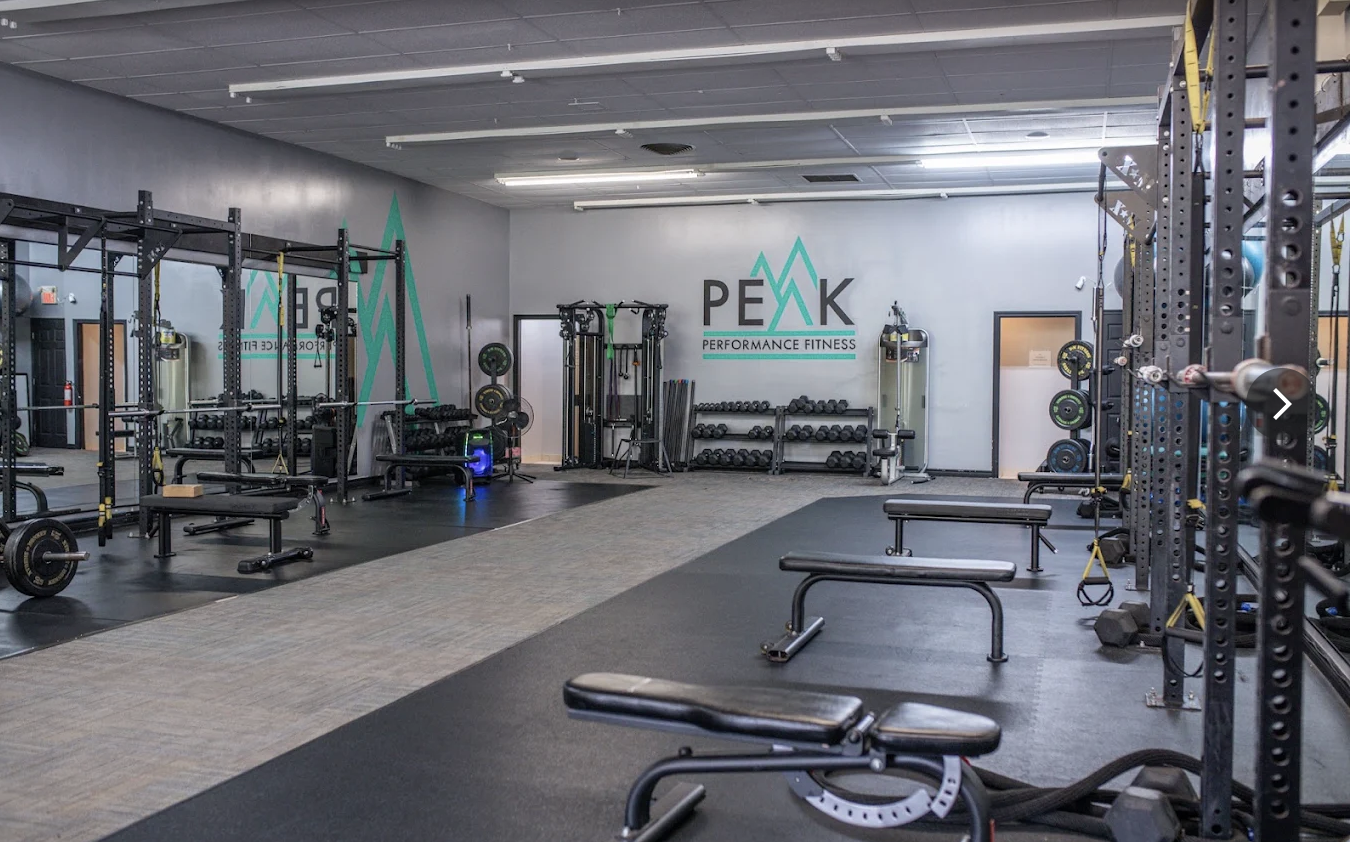 Athlete training with a barbell inside Peak Performance Fitness in Orillia